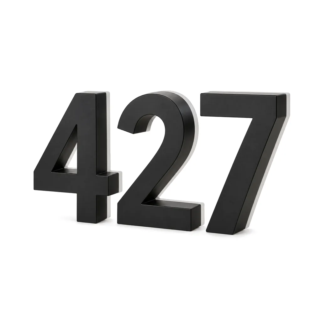 Halo-lit house numbers 4, 2 and 7 in matte black stainless steel, unlit, on a white background