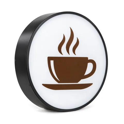 Round LED lightbox with a slim black metal ring and a brown coffee-cup pictogram on the face, on a white background