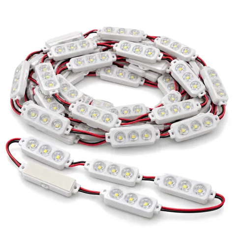 Coil of white 3-LED channel letter modules joined by red and black wire, a few laid flat in front, on white