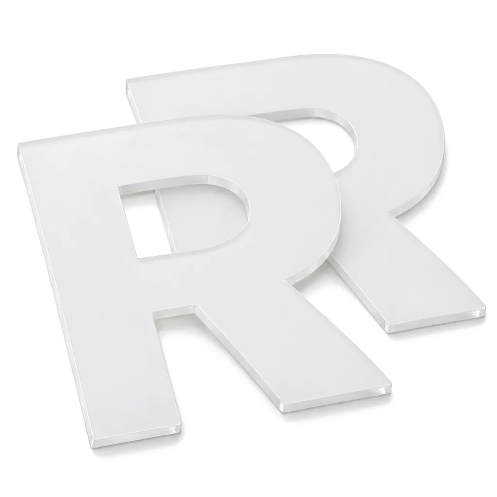 Two cut-out white translucent acrylic faces shaped like a capital R, one lying in front of the other, on white