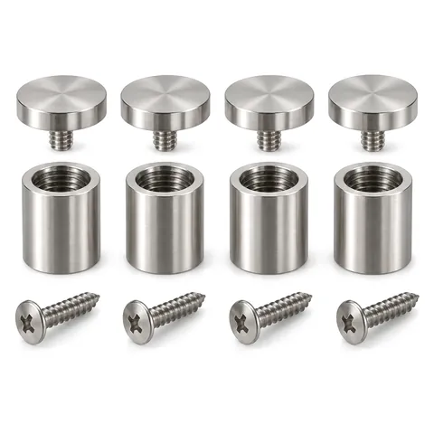 Four brushed stainless steel sign standoffs, each taken apart into cap, barrel and screw, laid in a row, on white