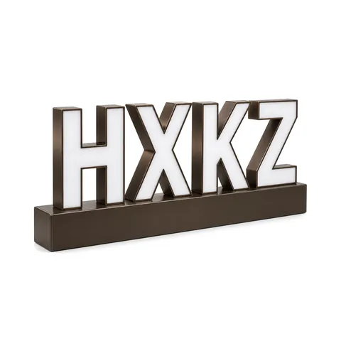 Four front-lit channel letters with white faces mounted on a slim dark bronze raceway, unlit, on white